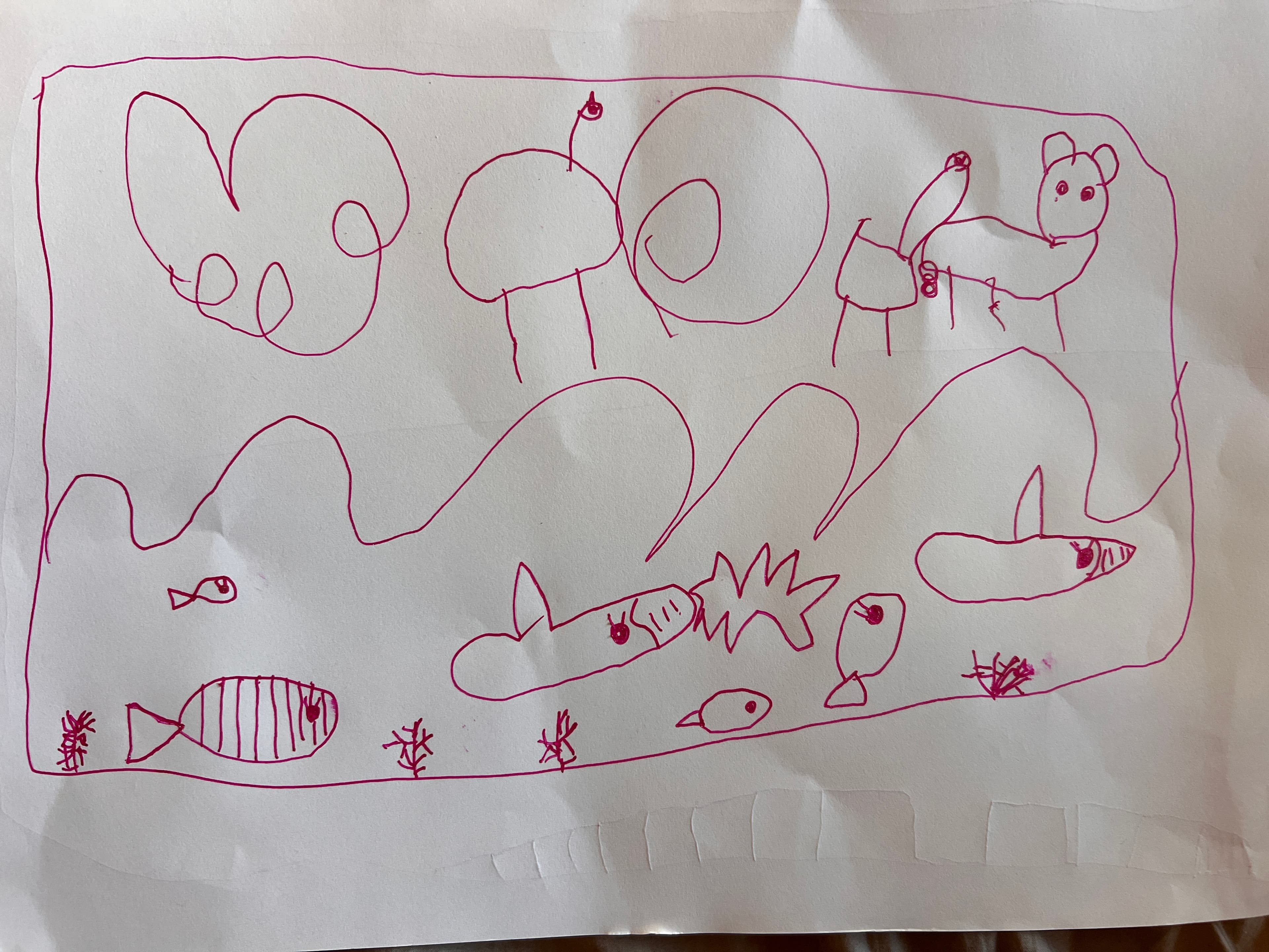 Leona’s pen drawing of animal-shaped clouds, waves, fish, sharks and coral.