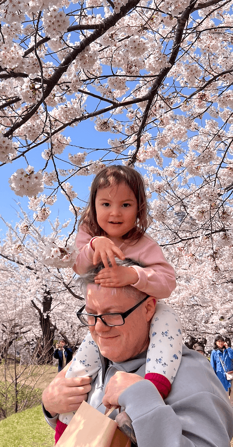Leona under sakura blossoms